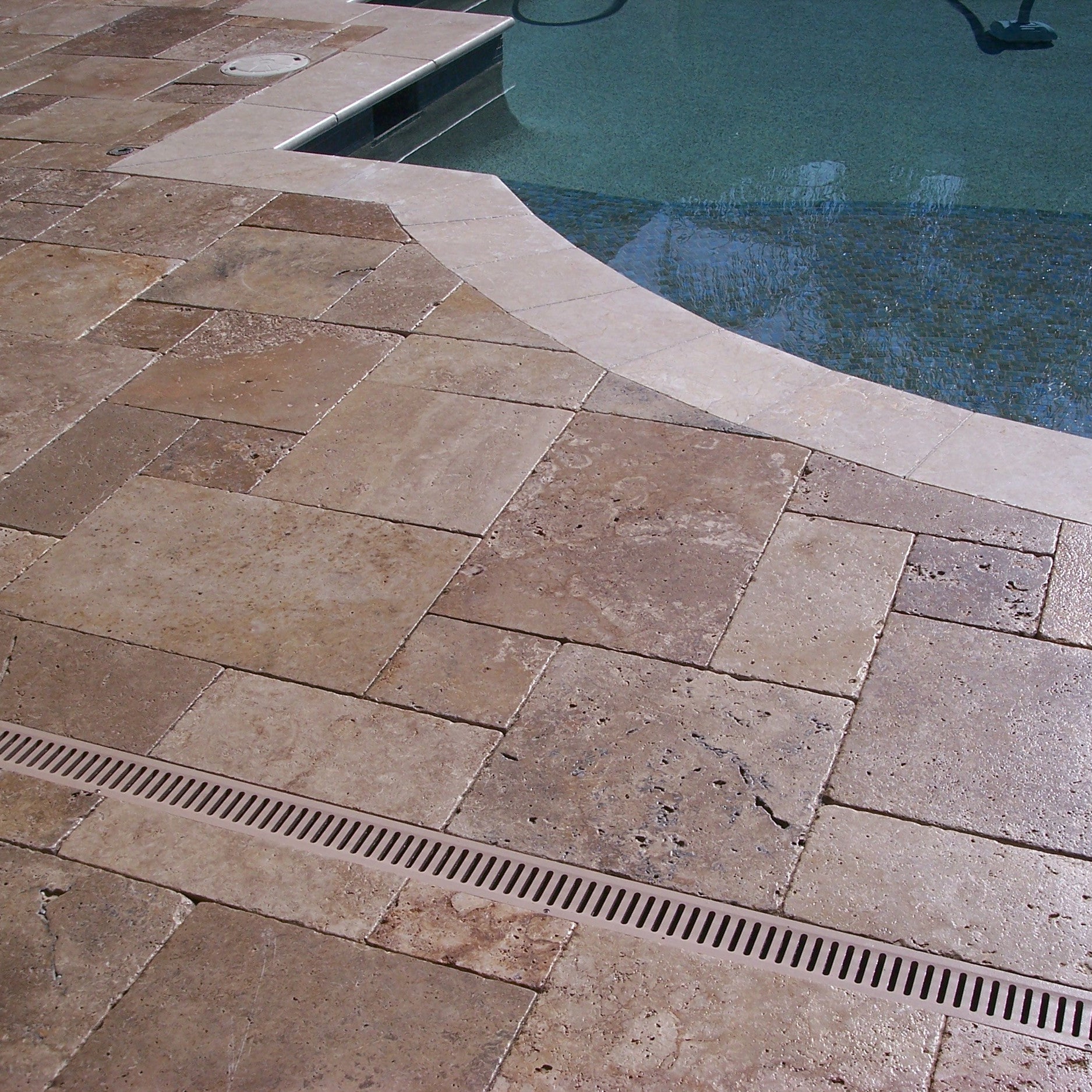 Installed Versailles tile pattern with travertine in warm beige tones