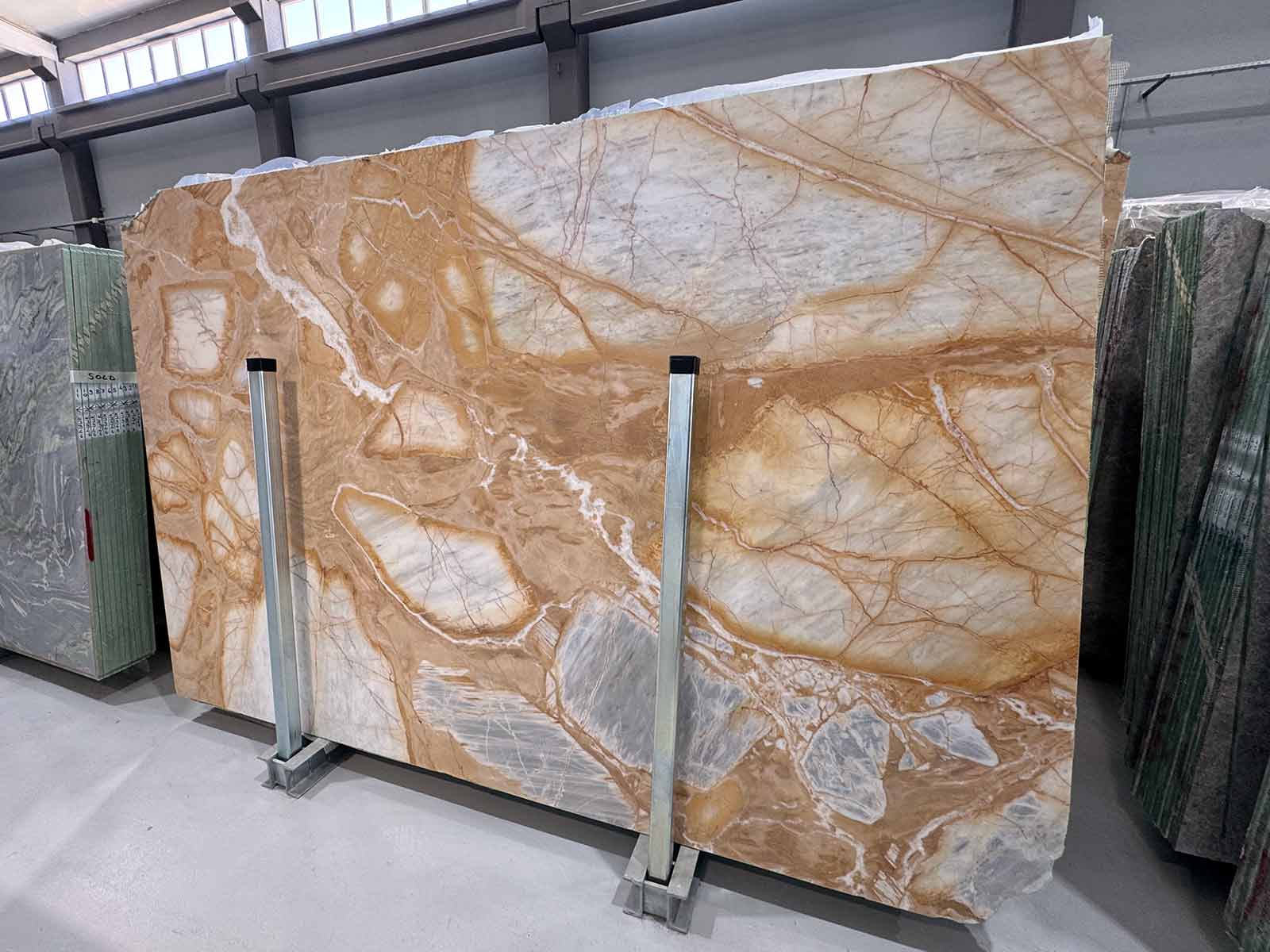 Golden Dune Marble Slab in polished finish showing gold, ivory, and gray tones