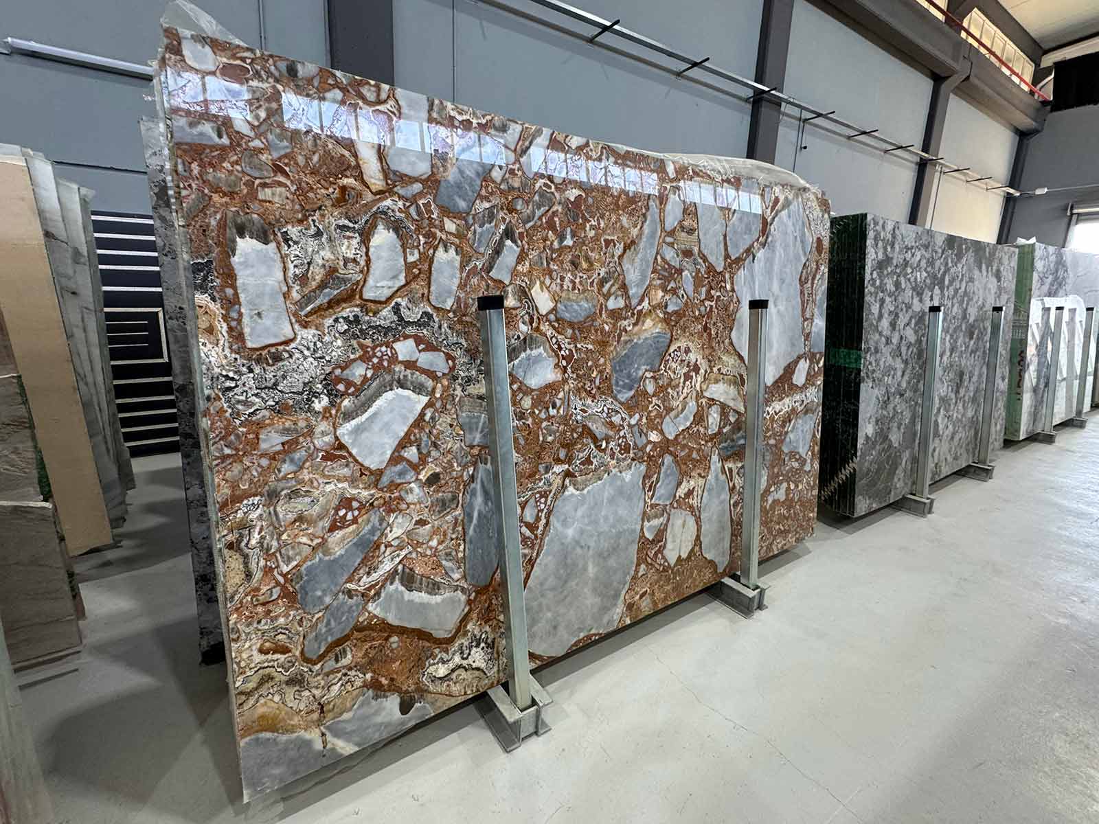 Red Fusion Marble Slab showing intricate veining and color mix