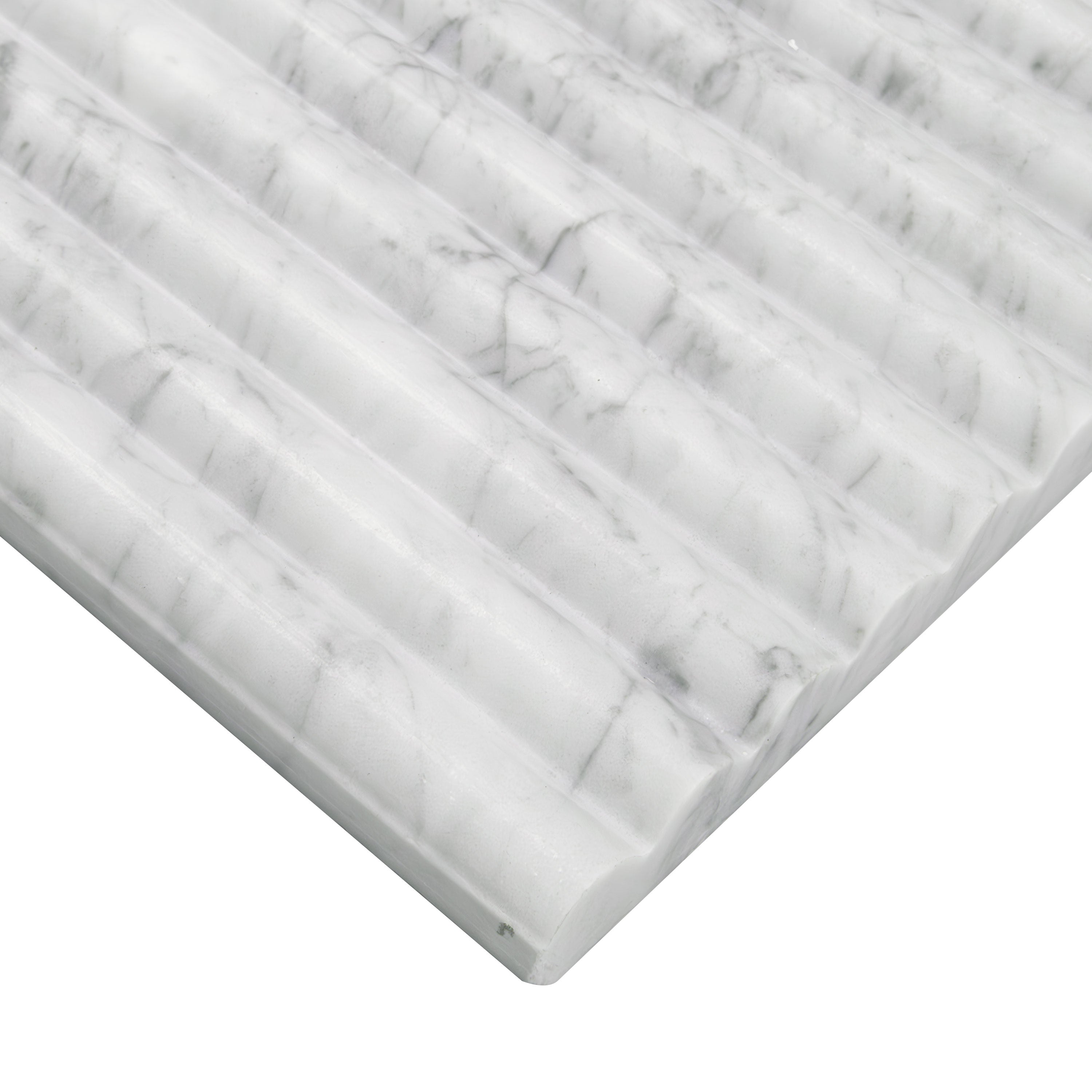 Edge of Carrara White marble showing ribbed texture and elegant gray veining