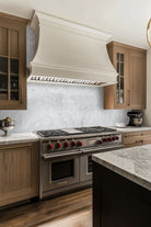 Carrara White Milano Ribbo Marble Tiles installed on kitchen wall with honed finish