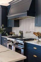 Folk Pearl Fluted Tiles installed on kitchen backsplash with seamless, refined finish