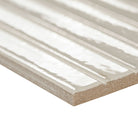 Edge of Gems Bianco showing glossy surface and linear fluted texture