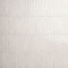 Flat view of Gems Bianco Fluted Tile, 5x10 porcelain with glossy finish and pre-scored slat design