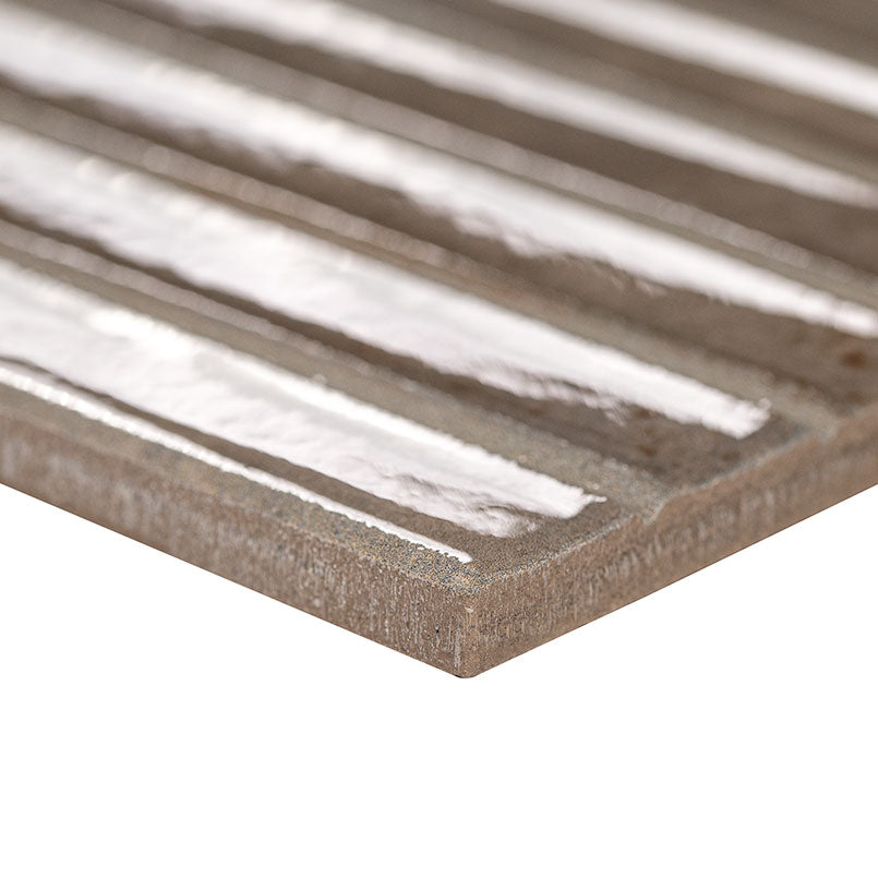 Close-up of Gems Grigio showing soft green tones, copper accents, and fluted texture