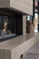 Gems Grigio Fluted Tiles installed on a fireplace wall with seamless grout finish