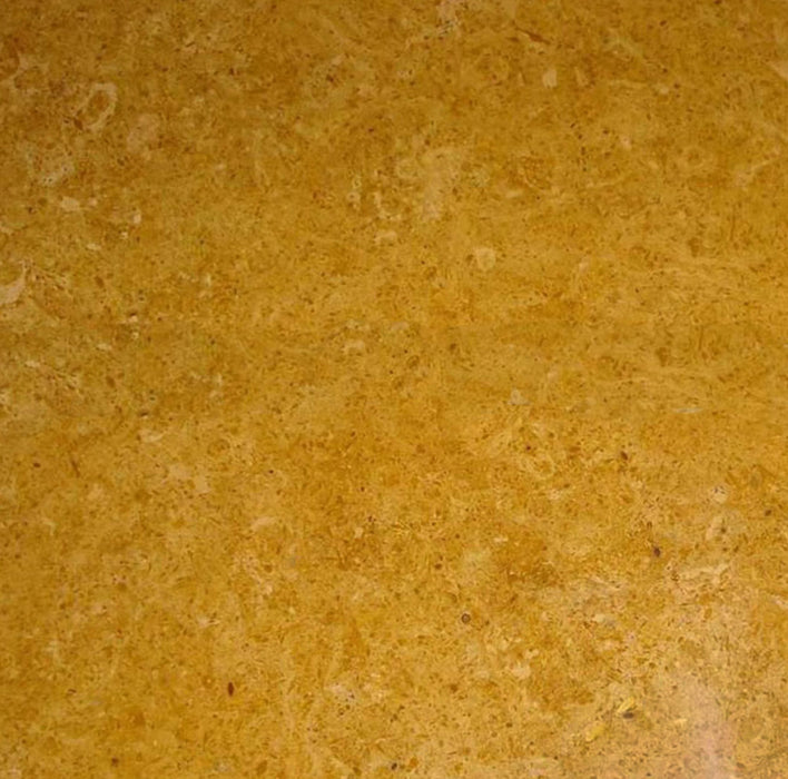 Close-up of Inca Gold Marble 18x18 tile showing warm golden veining on polished surface