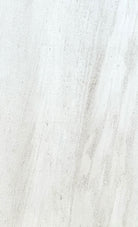 Flat lay of Mocha Cream Limestone Brushed Tile 18x36 showing subtle streaking and organic texture