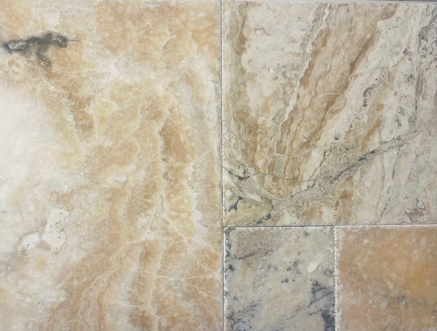 Close-up of Picasso Travertine showing natural variation and chiseled edge detail