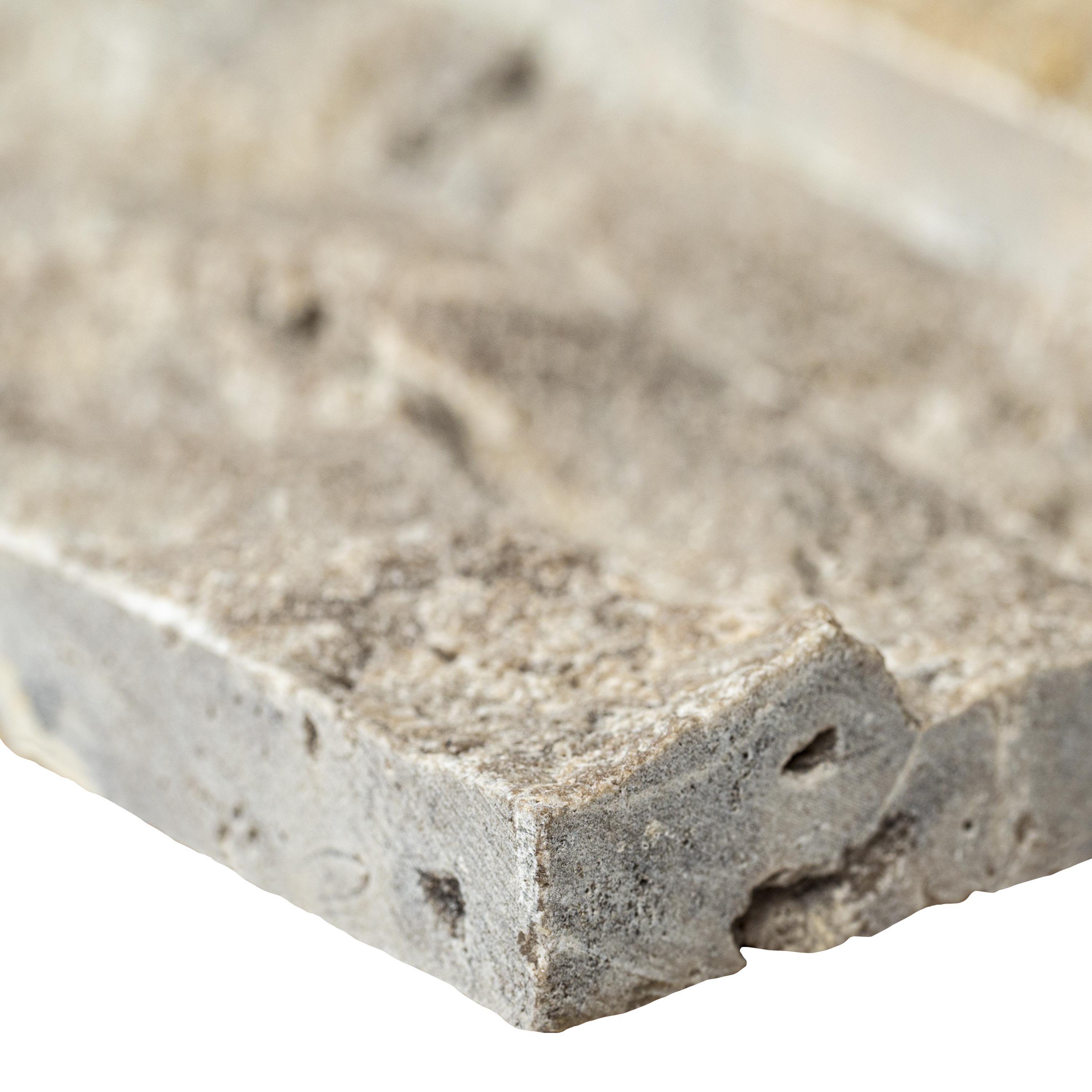 Close-up of Silver Travertine showing soft gray tones and natural texture