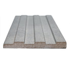 Close-up of Sinfonia Hip Hop Ceniza showing fluted 3D texture and natural stone-inspired tones