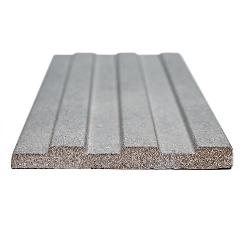 Close-up of Sinfonia Hip Hop Ceniza showing fluted 3D texture and natural stone-inspired tones