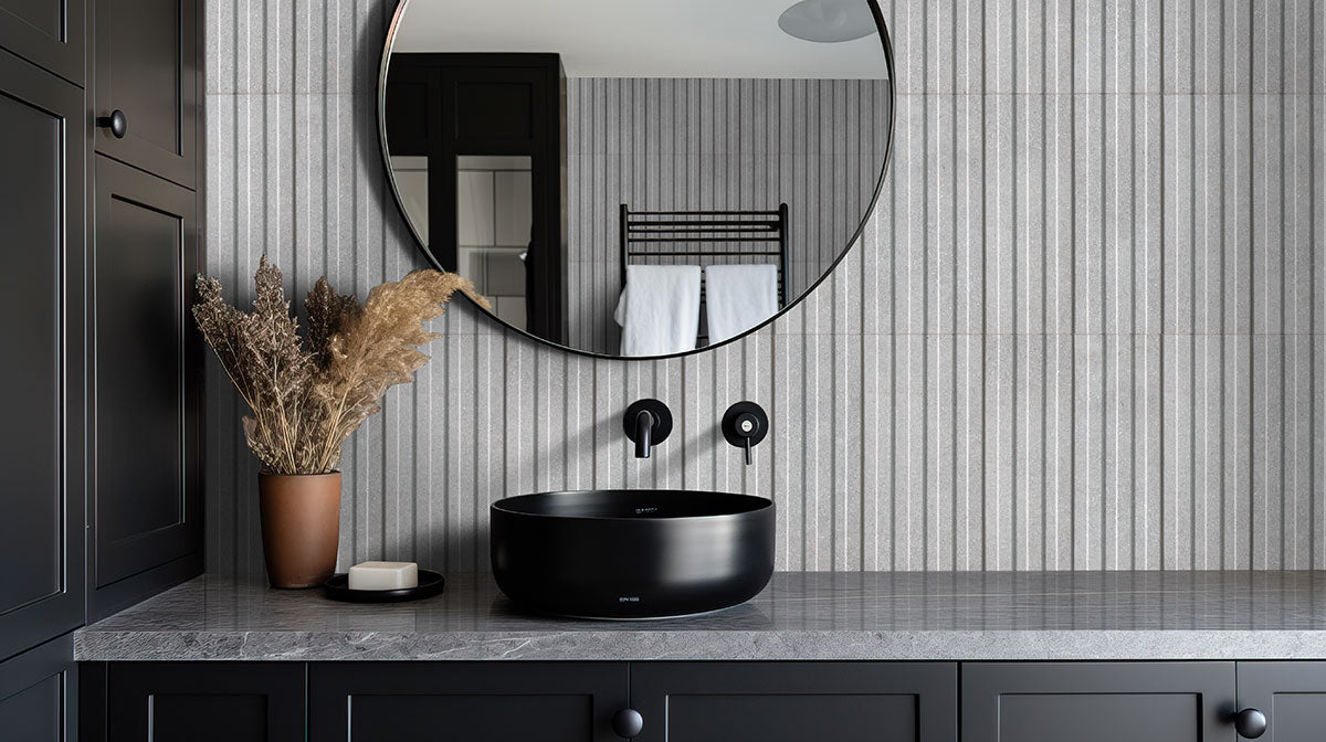 Sinfonia Hip Hop Ceniza Fluted Tiles installed on modern bathroom wall with seamless, elegant finish