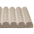 Close-up of Sinfonia Piano Arena showing fluted 3D texture and warm beige tones