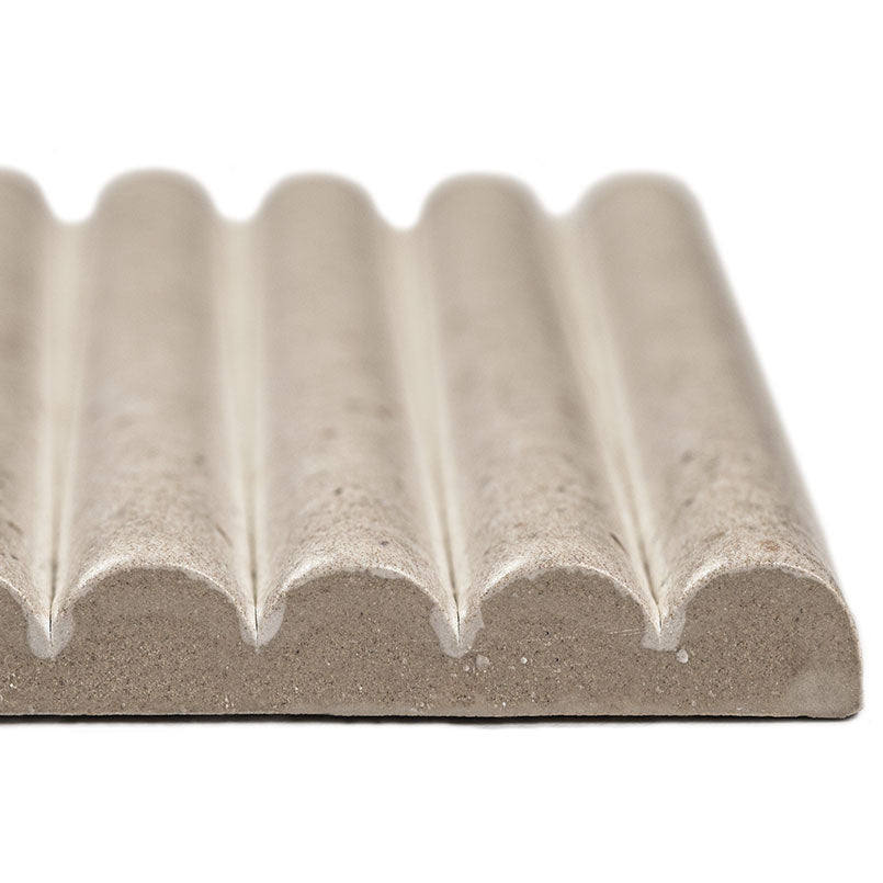 Close-up of Sinfonia Piano Arena showing fluted 3D texture and warm beige tones