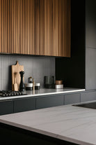 Sinfonia Piano Ceniza Fluted Tiles installed on kitchen wall with elegant vertical layout