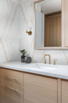 Urbanslat Marmi Gold Wall Panels installed on modern bathroom with seamless vertical layout