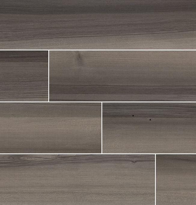 Flat lay of Acazia Blackwood 6x36 porcelain tile showing linear gray veining