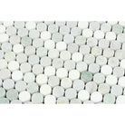 Close-up of penny round Arabescato Carrara marble mosaic showing soft green veining