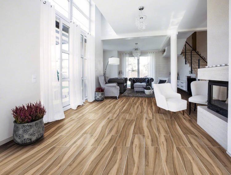 Close-up of Aspenwood Café porcelain tile with warm wood knots and matte finish