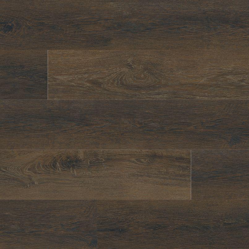 Flat lay view of Barrel luxury vinyl plank flooring in deep chocolate brown with wood grain detail