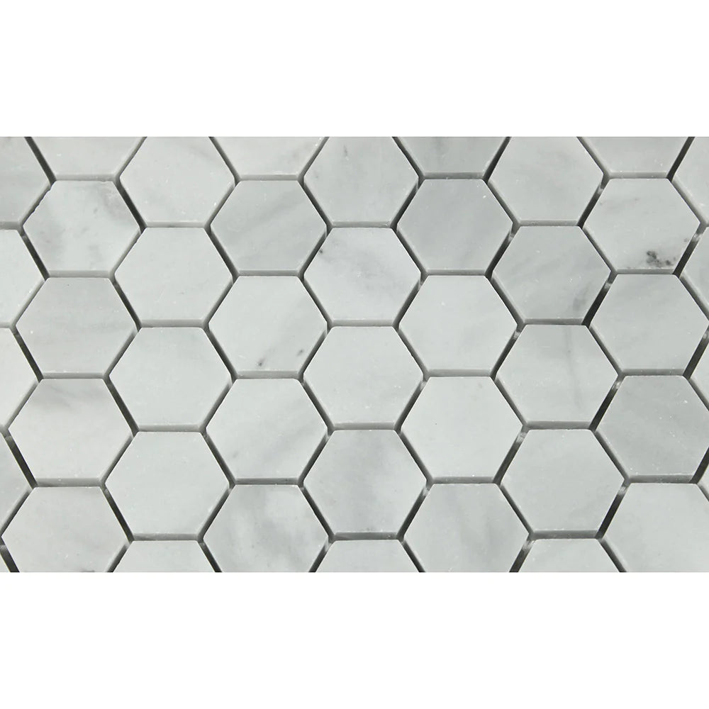 Close-up of Bianco Mare marble hex tiles showing soft gray veining