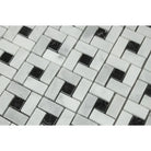 Close-up of Bianco Mare Pinwheel tile showing polished white marble and black center details
