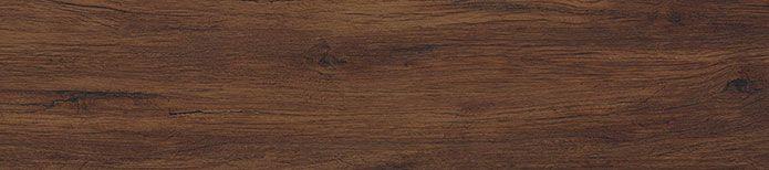 Close-up detail of Braly vinyl plank surface with dark wood grain and smooth texture