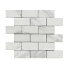 Close-up of Calacatta marble veining in 2"x4" brick layout