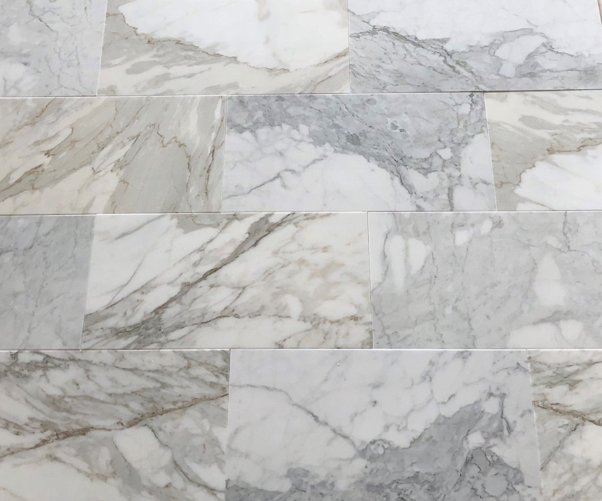 Calacatta Gold 12x24 marble tiles installed on bathroom or kitchen wall