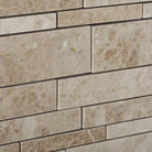Close-up of Cappuccino marble strip mosaic showing natural variation