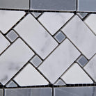 Close-up of basketweave border tile with polished Carrara marble and blue marble dot accents