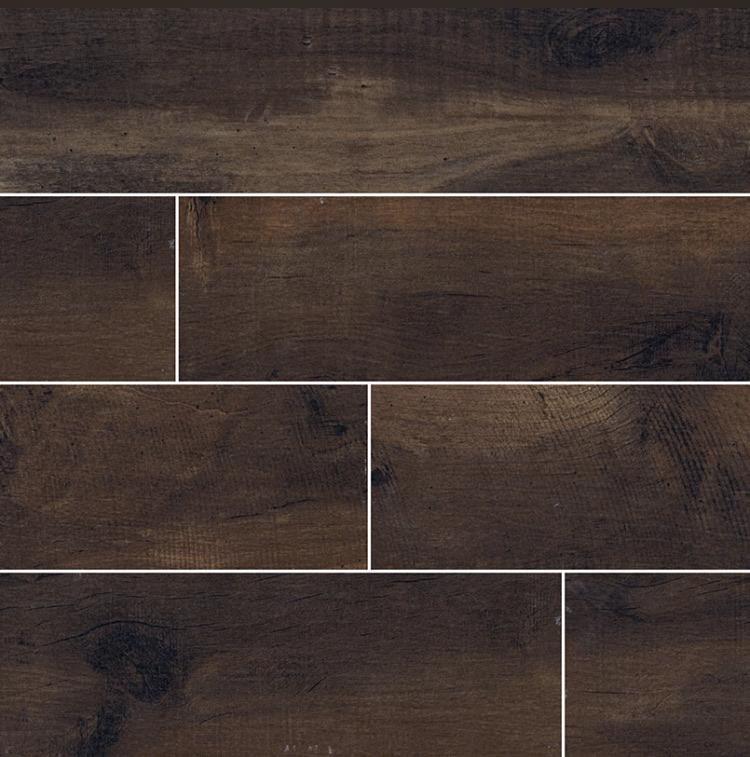Flat lay of Country River Bark 8x48 wood-look tile with dark brown tones and natural grain pattern