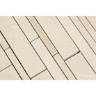 Close-up of polished Crema Marfil random strips showing color and veining