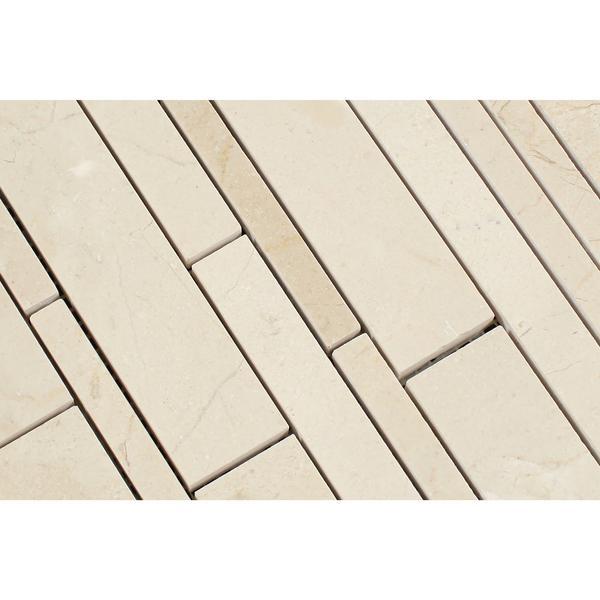 Close-up of polished Crema Marfil random strips showing color and veining