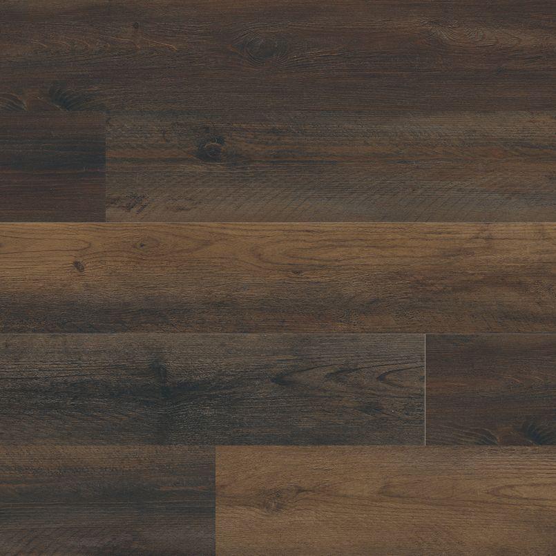 Flat lay of Hawthorne luxury vinyl tile in dark brown tones with realistic woodgrain