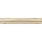 Close-up of Ivory Travertine corner molding showing L-profile and soft matte surface