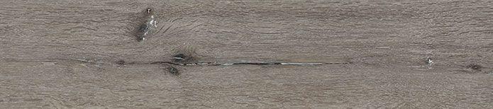 Close-up of Ludlow vinyl plank surface highlighting detailed wood texture and knots