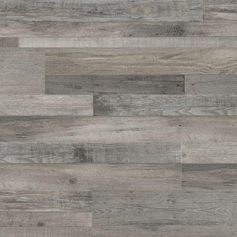 Flat lay of Mezcla Luxury Vinyl Tile showing soft gray and greige tones with realistic wood grain