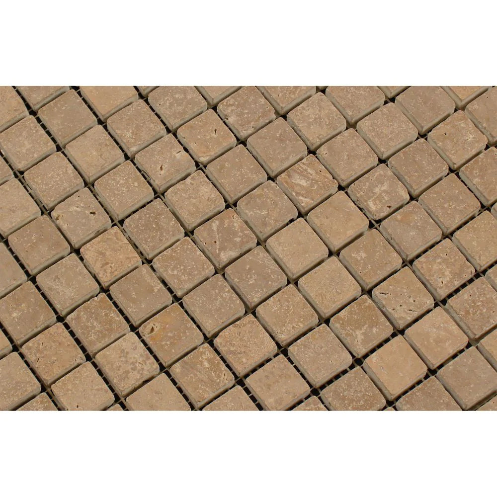 Close-up of Noce Travertine 1x1 tumbled tile surface