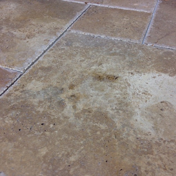 Rustic chocolate tone natural stone tile pattern