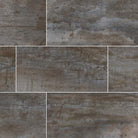 Flat lay of Oxide Iron porcelain tile showing warm gray and brown tones with metallic texture