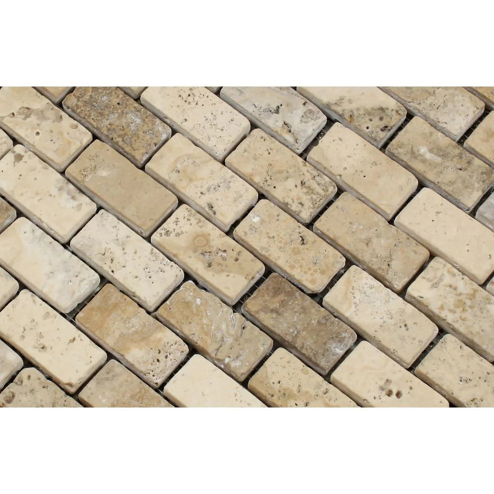 1x2 tumbled brick pattern in neutral travertine tones