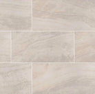 Flat lay of Praia Crema 24x48 porcelain tile in soft cream with matte finish