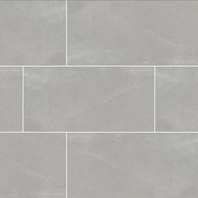 Flat lay of Sande Gray 24x48 polished porcelain tile with soft soapstone-inspired veining