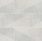 Flat lay of Sande Ivory 24x48 porcelain tile in matte finish with soft beige linear pattern