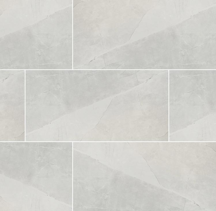 Flat lay of Sande Ivory 24x48 porcelain tile in matte finish with soft beige linear pattern