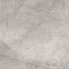 Flat lay of Smokey Grey 24x24 porcelain tile in gradient grey tones and textured matte finish