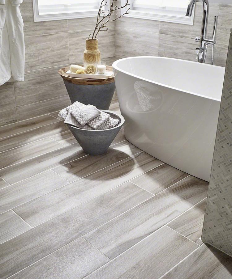 Close-up of Aspenwood Ash tile highlighting deep wood veining and glazed matte finish