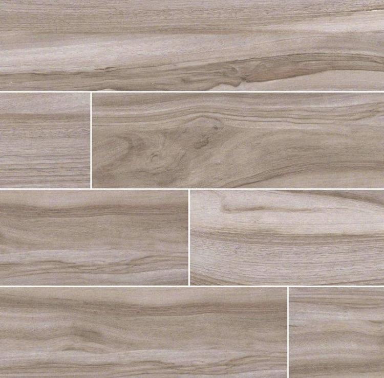 Flat lay of Aspenwood Ash 9x48 wood-look porcelain tile showing dramatic gray grain and plank texture